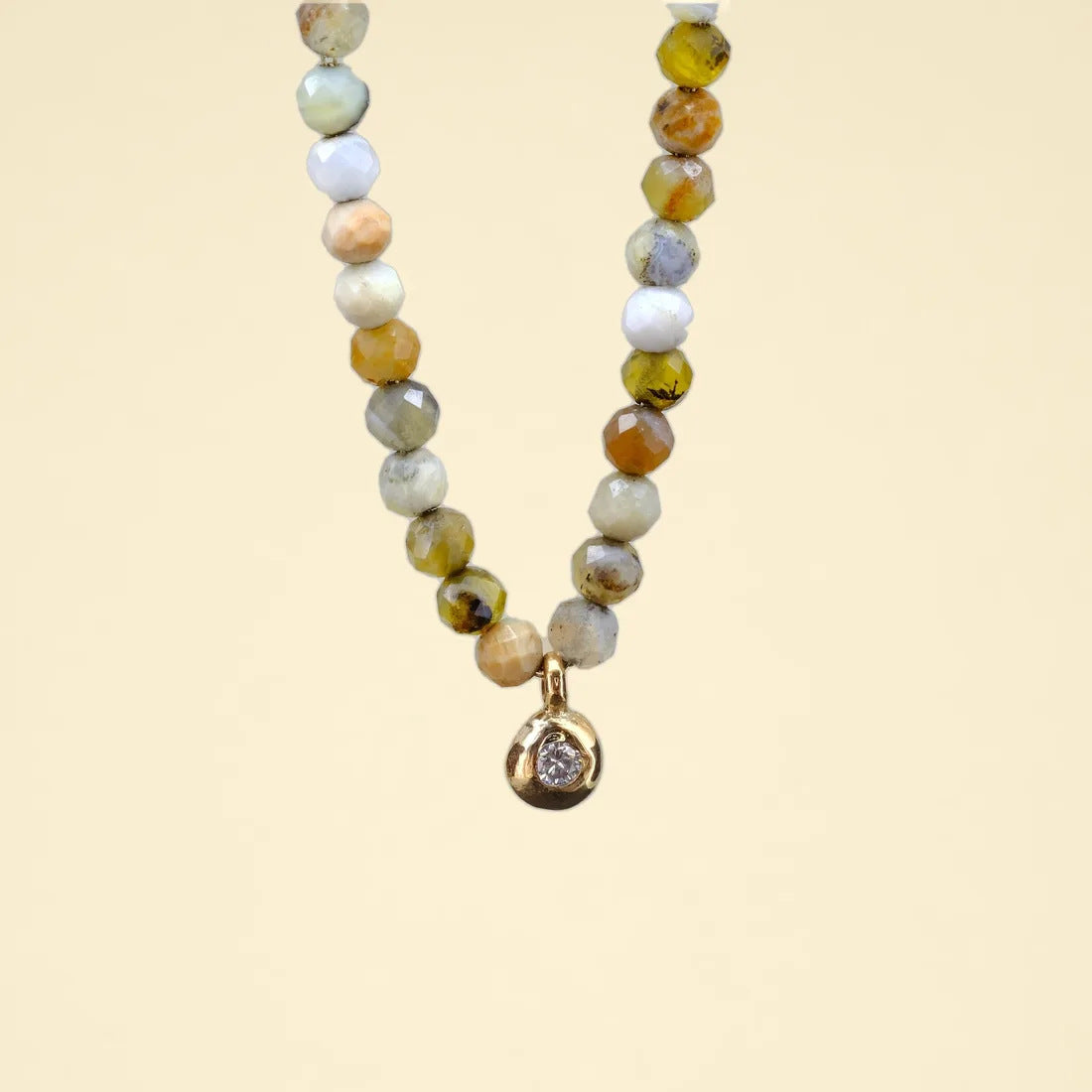 Yellow opal beaded necklace on a gold rope chain with a diamond drop