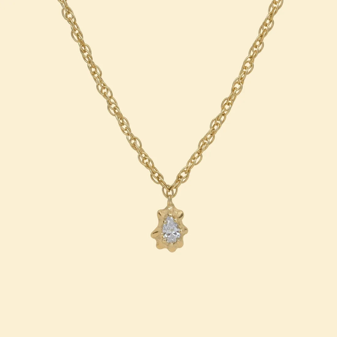 Pear diamond pendant, a pear-cut diamond set in a gold limpet shell