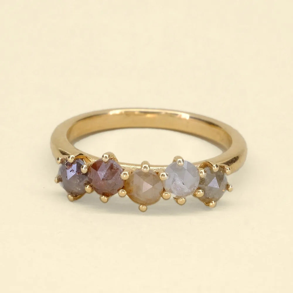 Rose cut star ring, a gold band with five rose-cut diamonds in earthy tones