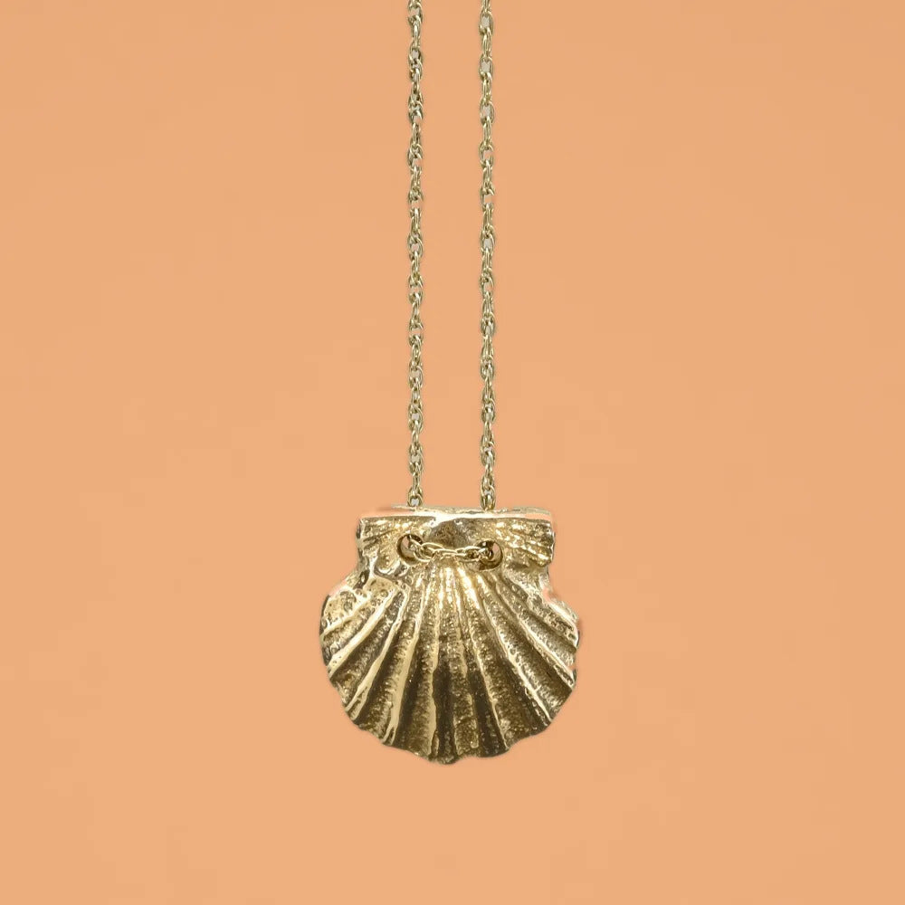 Scallop pendant, a gold scallop shell on a fine chain