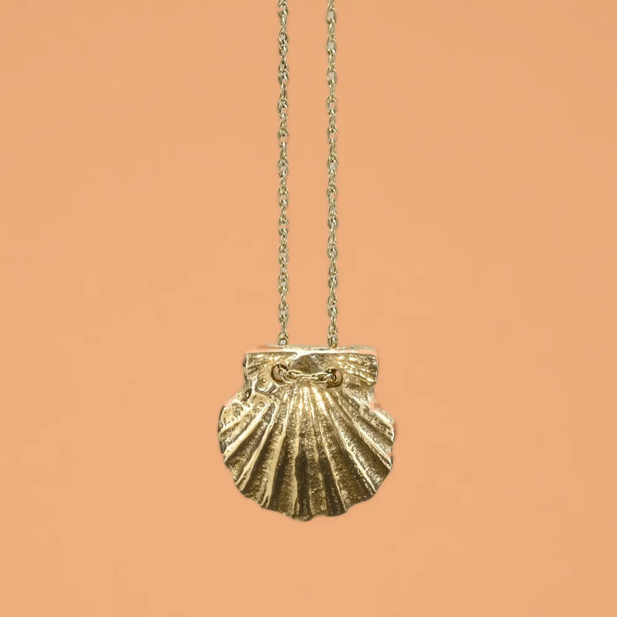 Scallop pendant, a gold scallop shell on a fine chain