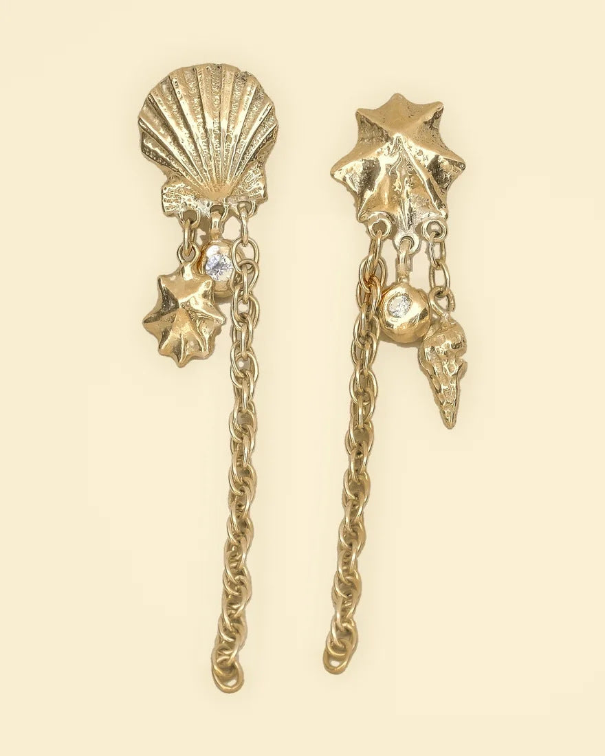 Statement shell earrings, gold cast shells with a diamond and long chain drops